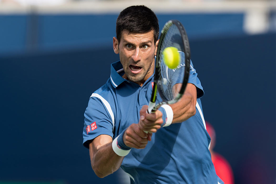 July 31, 2016: Novak Djokovic of Serbia & Montenegro returns the ball to Kei Nishikori of Japan during the Rogers Cup tournament final at the Aviva Centre in Toronto, Ontario, Canada on July 31, 2016.