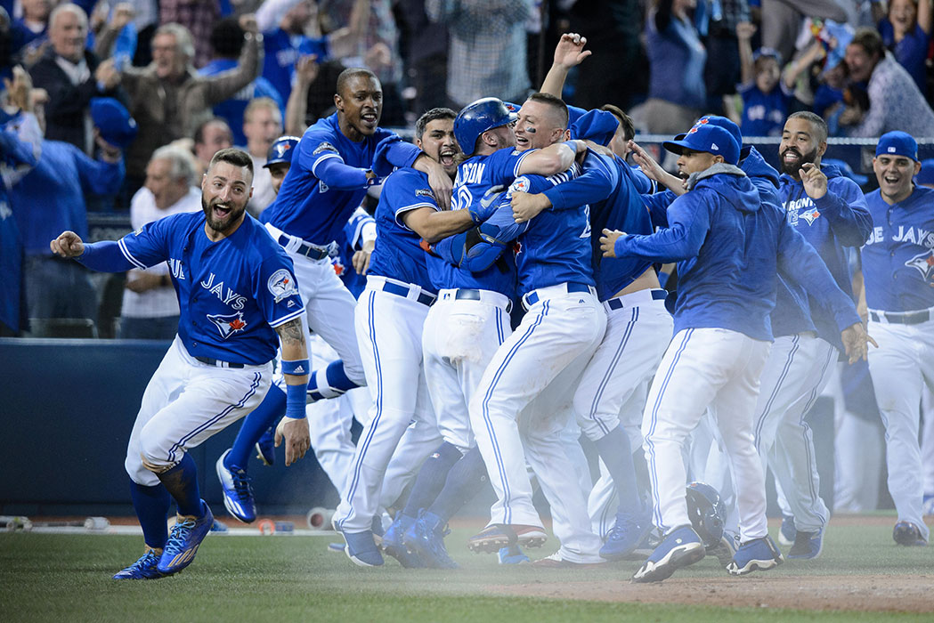 October 9, 2016: Kevin Pillar (11), Josh Donaldson, Troy Tulowitzki (2) and other Toronto Blue Jays players celebrate after winning the MLB ALDS Game 3 against Texas Rangers by a score of 7-6 in the tenth inning at Rogers Centre in Toronto, ON, Canada.