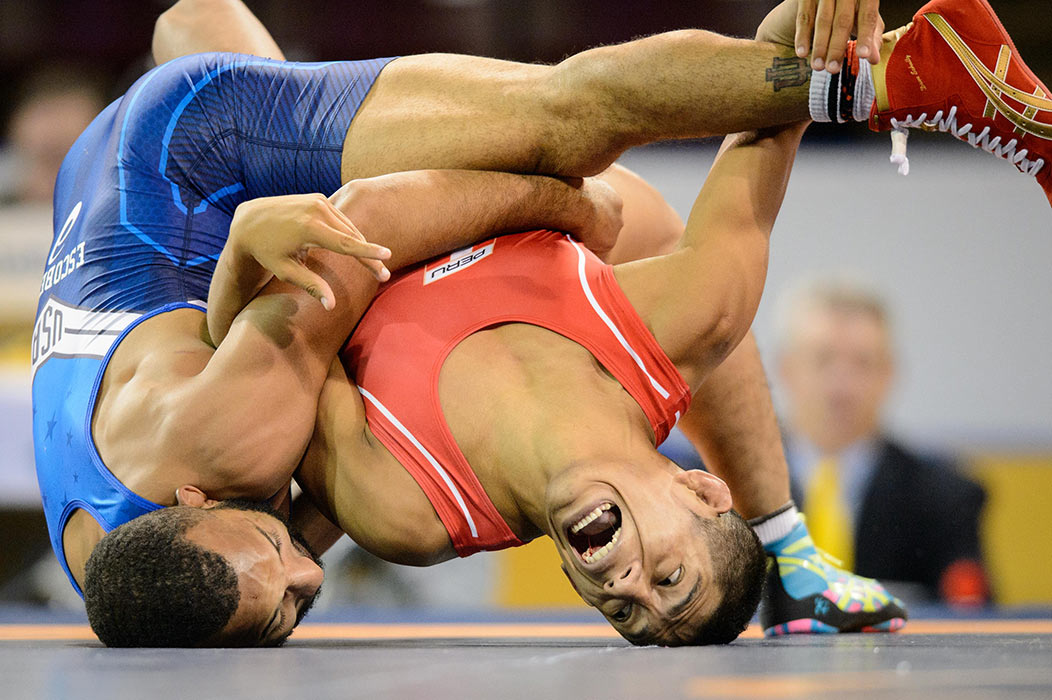 July 17, 2015: Angel Escobedo of the United States tries to pin Pablo Benitez of Peru during the Men's Freestyle 57 kg Semifinals at Hershey Centre in Mississauga, Ontario, Canada.